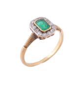 An emerald and diamond cluster ring , circa 1920   An emerald and diamond cluster ring  , circa