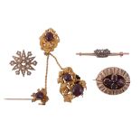 A small collection of brooches, comprising a damaged garnet set brooch   A small collection of