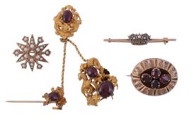 A small collection of brooches, comprising a damaged garnet set brooch   A small collection of