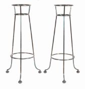 A pair of electroplated openwork stands for wine coolers, 67cm high Provenance   A pair of