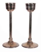 A pair of electroplated columnar stands for wine coolers by Wisemann   A pair of electroplated