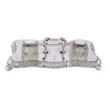 A late Victorian silver shaped oblong inkstand by James Dixon  &  Sons Ltd   A late Victorian silver