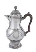 A silver ogee baluster hotwater pot by Crichton Bros, London 1916   A silver ogee baluster