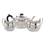 A silver oval three piece tea service by Harrods Ltd   A silver oval three piece tea service by