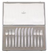 A cased set of six silver Cypress pattern fruit knives and forks by Georg...   A cased set of six
