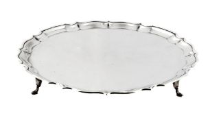 A silver shaped circular salver by Barker Bros, Chester 1914   A silver shaped circular salver by