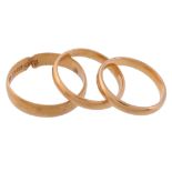 A 22 carat gold ring, the band of plain polished form   A 22 carat gold ring,   the band of plain