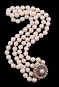 A cultured pearl necklace with sapphire and cultured pearl clasp   A cultured pearl necklace with