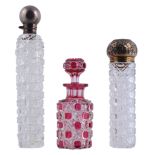 Three cut glass scent or dressing table bottles, all late 19th century   Three cut glass scent or