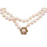 An opera length single row cultured pearl necklace   An opera length single row cultured pearl