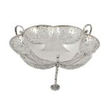 An Edwardian silver shaped circular dish by James Wakely  &  Frank Clarke Wheeler   An Edwardian