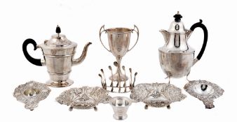 A collection of silver, including: a small tapered pedestal coffee pot by...   A collection of