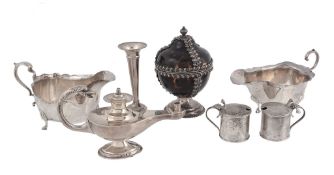 A collection of silver, including: a table lighter in the form of a wick lamp   A collection of