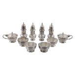 A silver ten piece octagonal cruet set by Goldsmiths  &  Silversmiths Co. Ltd   A silver ten piece