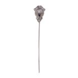 A sapphire and diamond stick pin, the panel with scroll detail set with...   A sapphire and