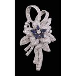 A sapphire and diamond floral spray brooch, circa 1950   A sapphire and diamond floral spray brooch,