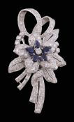 A sapphire and diamond floral spray brooch, circa 1950   A sapphire and diamond floral spray brooch,