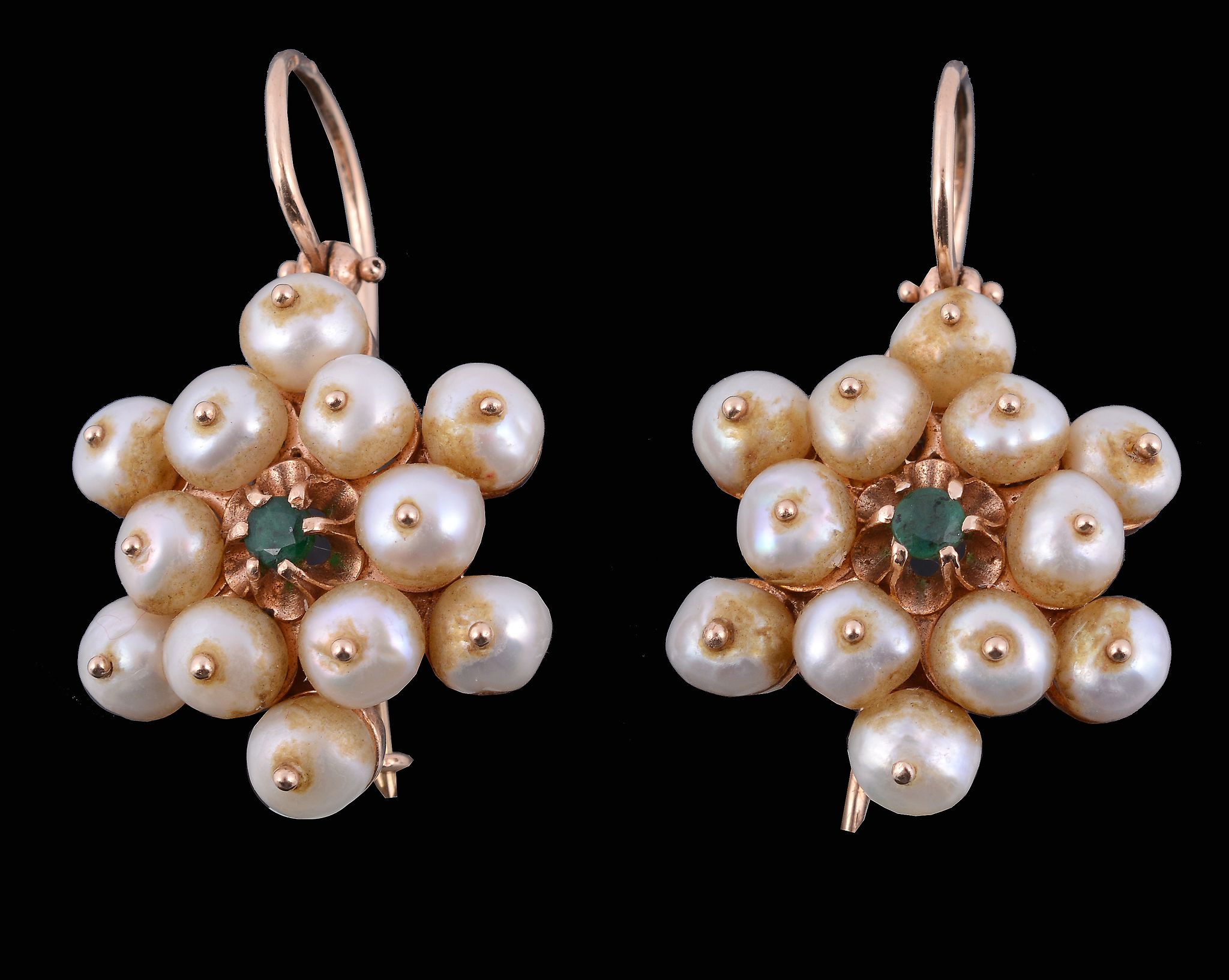 A pair of cultured pearl earrings, the cluster of cultured pearls centrally...   A pair of