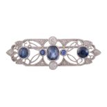 A sapphire and diamond brooch, the rectangular shaped panel with pierced...   A sapphire and diamond