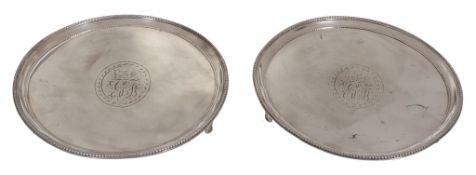 A pair of George III silver circular small salvers by John Crouch I  &  Thomas...   A pair of George