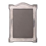 A silver mounted small photograph frame by Lionel Smith  &  Co   A silver mounted small photograph