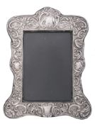 An Edwardian silver mounted photograph frame by J.  &  R   An Edwardian silver mounted photograph