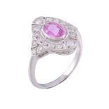 A pink sapphire and diamond cluster ring, the central oval cut pink sapphire...   A pink sapphire