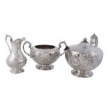 A Victorian silver compressed spherical three piece tea service by Martin   A Victorian silver