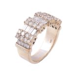 A diamond dress ring, the broad panel with rows of baguette cut diamonds...   A diamond dress ring,