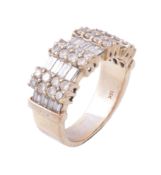 A diamond dress ring, the broad panel with rows of baguette cut diamonds...   A diamond dress ring,