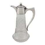 An Italian silver mounted cut glass small claret or licquor jug, pre 1934   An Italian silver