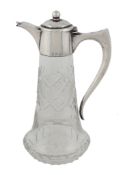 An Italian silver mounted cut glass small claret or licquor jug, pre 1934   An Italian silver