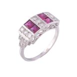 A ruby and diamond ring, the rectangular shaped panel set with calibre cut...   A ruby and diamond