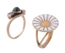 A daisy ring by Georg Jensen, the white enamelled flowerhead with a textured...   A daisy ring by