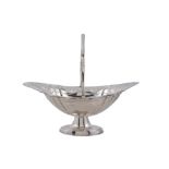 A silver shaped oval swing handled pedestal basket, maker's mark worn   A silver shaped oval swing