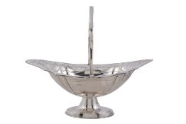 A silver shaped oval swing handled pedestal basket, maker's mark worn   A silver shaped oval swing