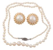 A pair of mabe pearl earrings, the central mabe pearl within a scalloped...   A pair of mabe pearl