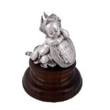 A Victorian silver model of a sleeping cherub, duty and standard marks only   A Victorian silver
