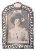 A late Victorian silver mounted photograph frame, maker's mark illegible   A late Victorian silver