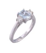 An 18 carat gold diamond and aquamarine three stone ring   An 18 carat gold diamond and aquamarine