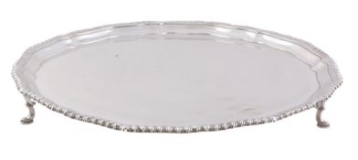 A silver shaped circular salver by Carrington  &  Co   A silver shaped circular salver by Carrington
