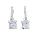 A pair of aquamarine and diamond earrings   A pair of aquamarine and diamond earrings,   the oval