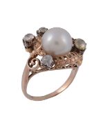 A cultured pearl and diamond dress ring, circa 1950   A cultured pearl and diamond dress ring,