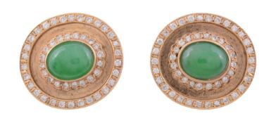 A pair of jadeite and diamond earrings, the oval shaped panels set with a...   A pair of jadeite and