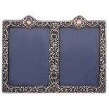 An Edwardian silver mounted double photograph frame, maker's mark J   An Edwardian silver mounted