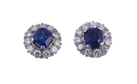 A pair of sapphire and diamond ear studs, the central square cut sapphire...   A pair of sapphire