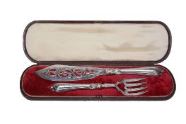 A pair of early Victorian silver fish servers, maker's mark JG   A pair of early Victorian silver