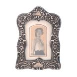 An Edwardian silver mounted small photograph frame by Williams Ltd   An Edwardian silver mounted