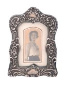 An Edwardian silver mounted small photograph frame by Williams Ltd   An Edwardian silver mounted