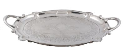 An Austro-Hungarian silver shaped oval twin handled tray, maker's mark SA   An Austro-Hungarian